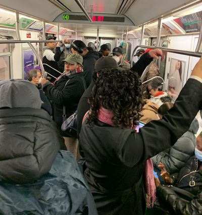 Riders on a crowded 4 train from the Bronx into Union Square on Monday morning.